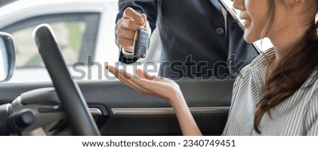 lease, rental car, sell, buy. Dealership manager send car keys to the new owner.  Sales, loan credit financial, rent vehicle, insurance,  renting, Seller, dealer, installment, car care business Royalty-Free Stock Photo #2340749451