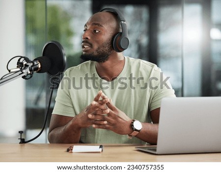 Black man, microphone and laptop, headphones and radio DJ with news, communication and audio equipment. Podcast, technology and multimedia with male person, talking with announcement and broadcast