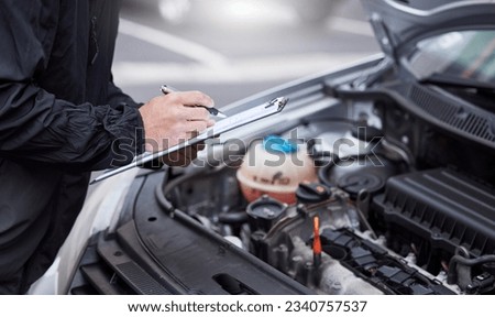 Car insurance, checklist and man writing on documents for compliance, maintenance and engine control. Vehicle, inspection and hand of male mechanic with paper form for information, note and claim Royalty-Free Stock Photo #2340757537