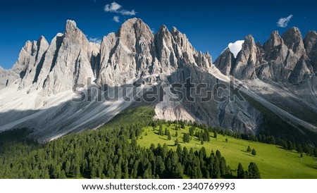 View of Geislergruppe or Gruppo delle Odle with chalet Dolomites, Italy , Europe. A beautiful view of the mountain peaks with beautifully lit green meadows
 Royalty-Free Stock Photo #2340769993