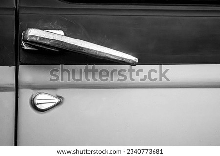 Door handle on old timer car in black and white