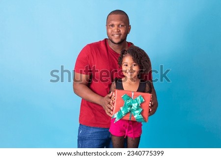 Father and afro daughter with father's day gift. Father's Day