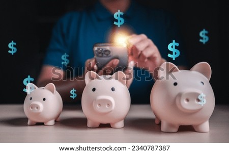 financial, banking, finance, investment, currency, profit, money, wealth, invest, investing. touching smartphone for investment check with piggy banking in focus. invest and cryptocurrency has risk.
