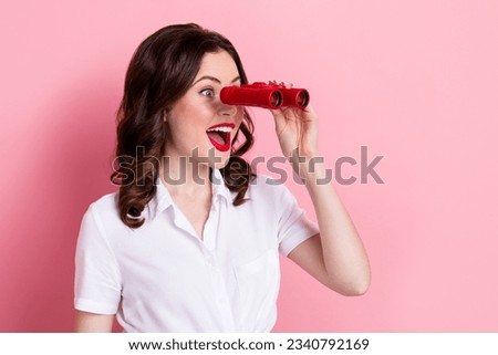 Photo of adorable excited lady wear white blouse looking enlarging lens empty space isolated pink color background
