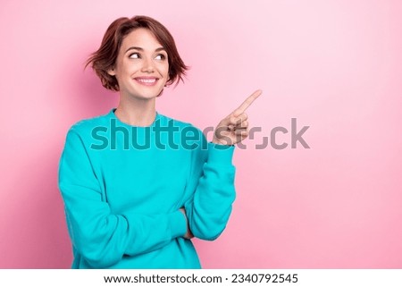 Photo of nice curious woman promoter indicating finger empty space interesting poster sale offer isolated pink color background