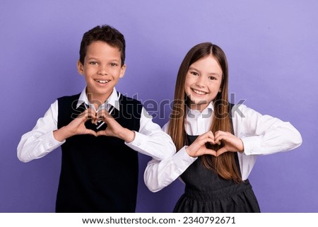 Photo of schoolkids in classroom make heart sign love school isolated on bright color background
