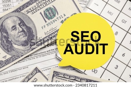seo audit words on yellow sticker with dollars and charts
