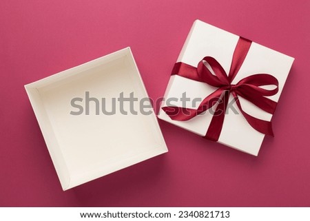 Open gift box on color background, top view. Mock up for design Royalty-Free Stock Photo #2340821713