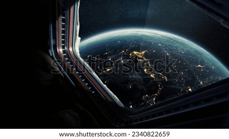 Spaceship flies near the amazing night planet earth, view from the window. Travel and tourists in space, concept. Beautiful space view of the Earth with night city lights. Hotel in space
