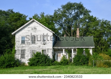 Old and weathered wooden farmhouse Royalty-Free Stock Photo #2340823533
