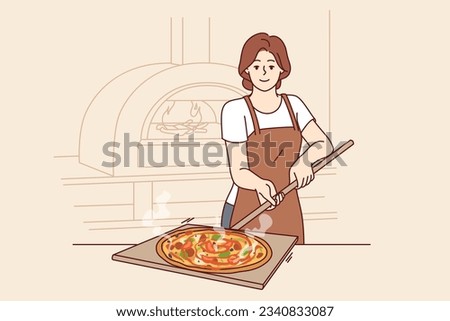 Woman is preparing pizza and holding shovel to take out dish from stone oven for cooking italian food. Pizzeria chef in apron demonstrating delicious margherita or pepperoni pizza with melted cheese