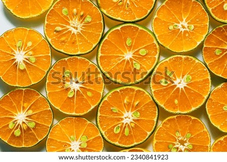 macro orange,Abstract background of orange citrus slices on white.