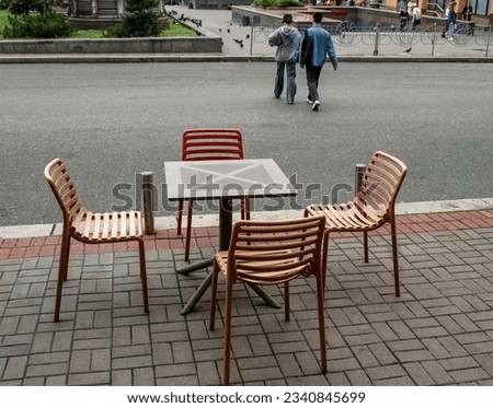 Table and chairs in a summer cafe
