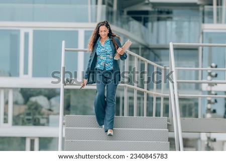 business woman on office stairs