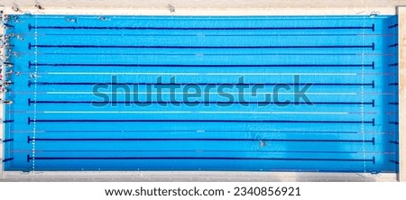 From above, you can see a group of swimmers training in a sports pool. Royalty-Free Stock Photo #2340856921