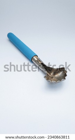 Stainless steel coconut meat scraper. Practical, strong, and easy to use to extract fresh coconut meat efficiently.