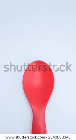 This Mixue spoon is designed with a bright red color.