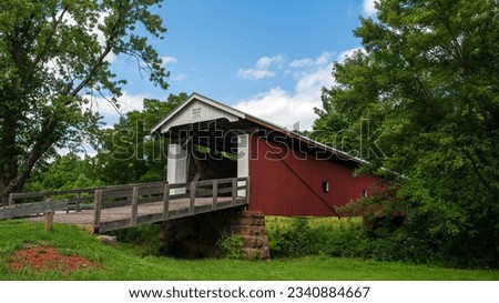 Bridge # 35-84-28

The Rinard Covered Bridge, near Marietta, Ohio, was built in 1876. The Smith truss bridge crosses the Little Muskingum River northeast of Wingett Run on County Road 406 in Ludlow. Royalty-Free Stock Photo #2340884667