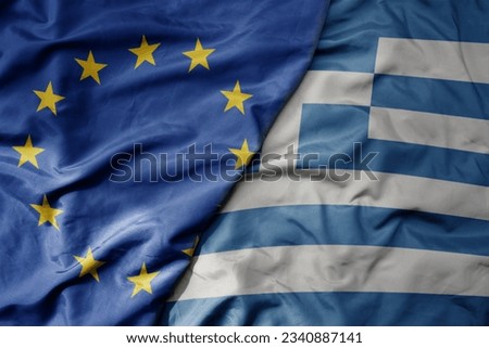 big waving realistic national colorful flag of european union and national flag of greece . macro