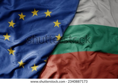 big waving realistic national colorful flag of european union and national flag of bulgaria . macro