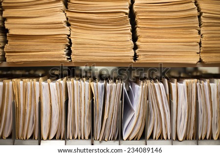 Shelf with file folders in a archives Royalty-Free Stock Photo #234089146