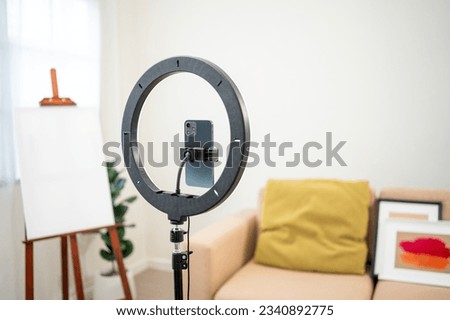 Equipment of influencer camera cell phone and light for recording create video content at home. Tools for live streaming internet online at home studio in living room
