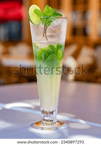 classic mojito cocktail on a table in an outdoor patio