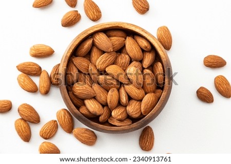 Almonds on a white background (overhead view)