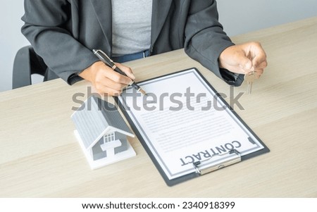 real estate agent hand holding pen and explains the business contract, rent, purchase, mortgage, a loan, or home insurance to buyer woman.
