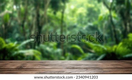 The empty wooden table top with blur background of Amazon rainforest. Exuberant image. Royalty-Free Stock Photo #2340941203