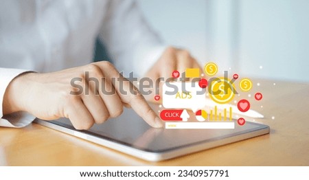 businessman hand touch screen on digital tablet to use marketing tool to announce promotion and special offer and checking traffic research of pay per click program on web page for online business