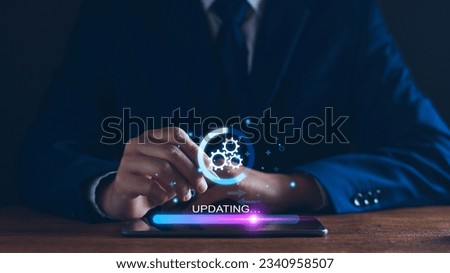 Operating system upgrade concept, installation app and software update process, modernize user equipment, update modern functions, developer released new version Improved security. User is downloading Royalty-Free Stock Photo #2340958507