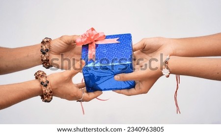 Raksha Bandhan concept, Indian brother giving gift to his sister