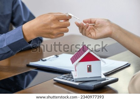 Real estate agents and buyers discuss signing a business contract, renting, buying, mortgage, loan or home insurance.