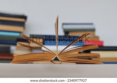 stack of colorful book with blurred background.