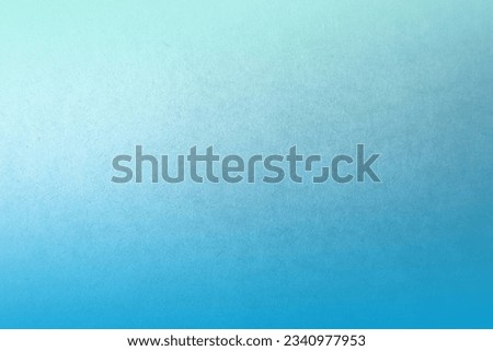 Natural soft pale light blue two tone color gradation with cyan paint on kraft cardboard blank box paper texture background with space minimal design