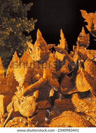It is a picture carved from the candle tree of Thailand.