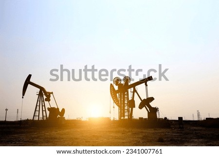 Oil field, oil pump in the work，Industrial equipment