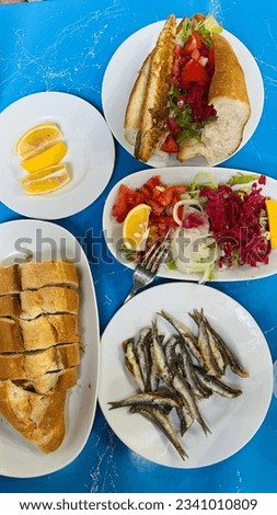 Fried fish with salad and bread