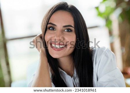 Portrait of adorable satisfied cheerful girl beaming smile arm touch cheekbone have good mood free time weekend flat inside Royalty-Free Stock Photo #2341018961