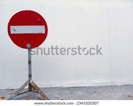a traffic sign in the corner of the wall