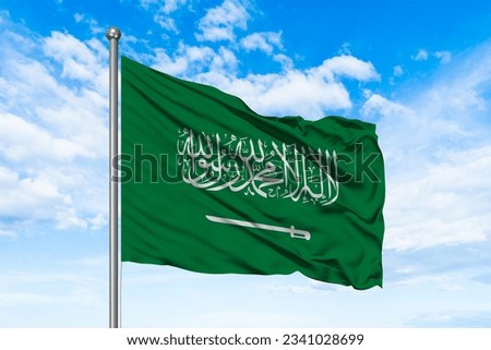 Saudi Arab flag waving in beautiful clouds.
