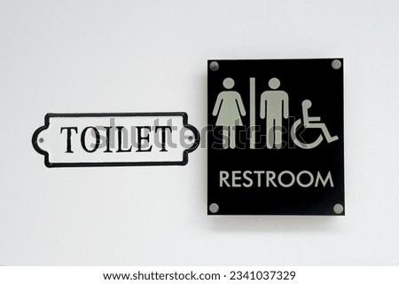 restroom sign on the wall