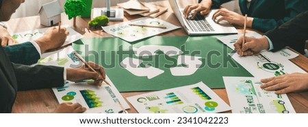 Group of business people planning and discussing on recycle reduce reuse policy symbol in office meeting room. Green business company with eco-friendly waste management regulation concept.Trailblazing Royalty-Free Stock Photo #2341042223
