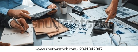 Auditor team collaborate in office, analyzing financial data and accounting record. Expertise in finance and taxation with accurate report and planning for company revenue, expense and budget. Insight Royalty-Free Stock Photo #2341042347