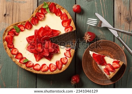 Baked Strawberry cheesecake New York with mint. Heart form. Homemade dessert top view Royalty-Free Stock Photo #2341046129