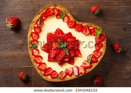 Baked Strawberry cheesecake New York with mint. Heart form. Homemade dessert top view Royalty-Free Stock Photo #2341046133
