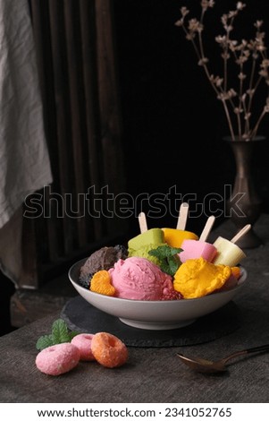 Various fruit flavored ice cream on a dark background