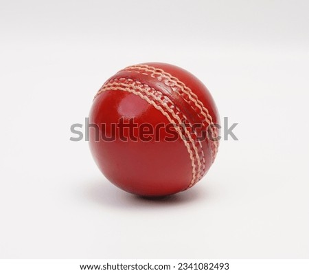 A Shiny New Test Match Cricket Ball Leather Hard Circle Stitch Closeup Picture On White Background Royalty-Free Stock Photo #2341082493