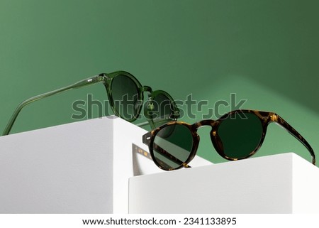 Sunglasses and glasses sale concept. Trendy sunglasses background. Trendy Fashion summer accessories. Copy space for text. Summer sale. Optic store discount poster. glasses with rounded frames. Royalty-Free Stock Photo #2341133895